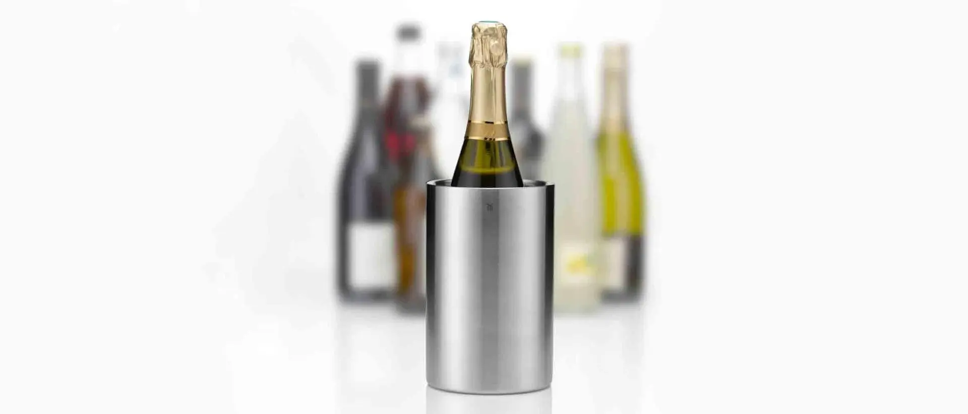 Wine Accessories  A fine collection of WMF wine accessories, including a wine cooler and a wine bottle stopper.